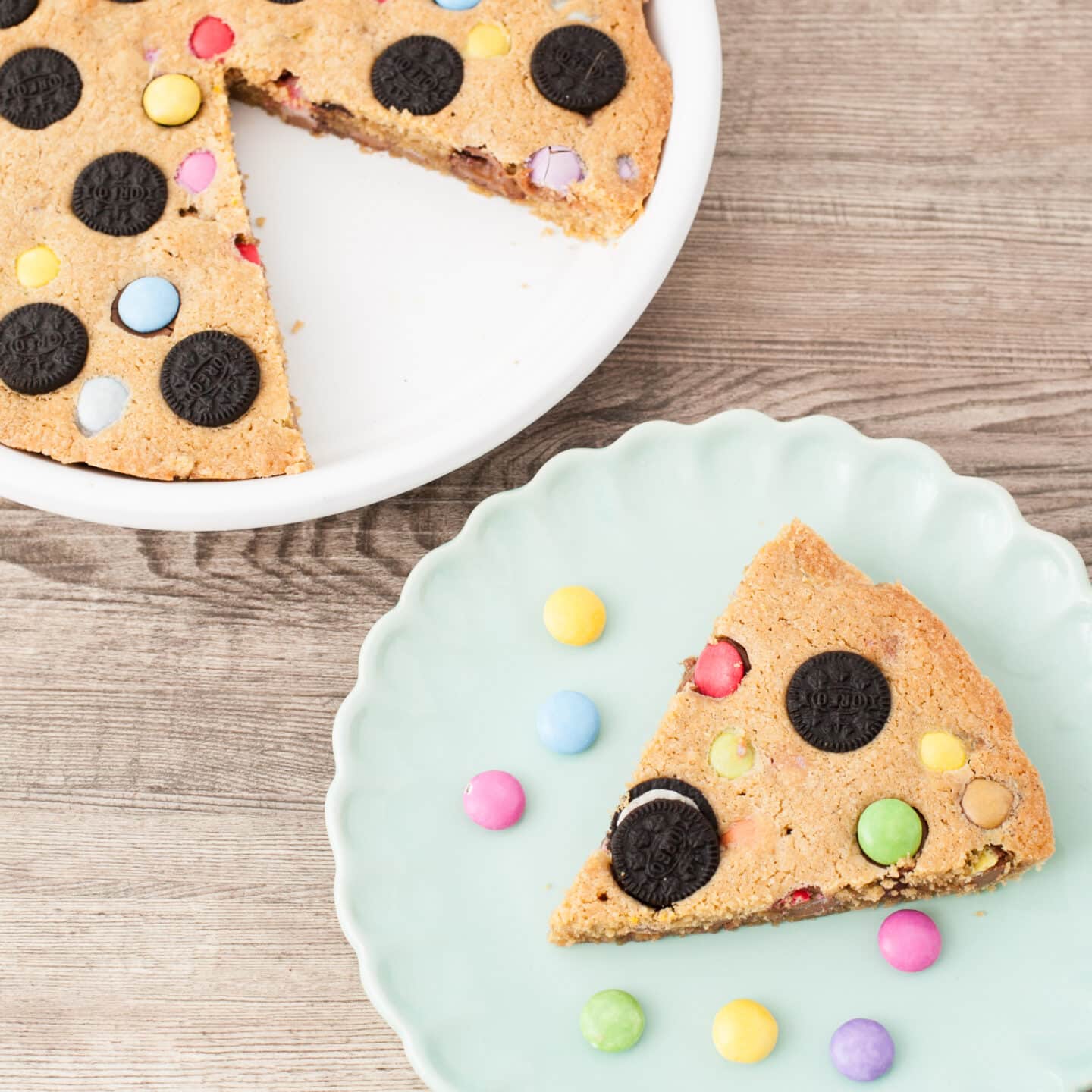 pretty cake with treats and cookie dough